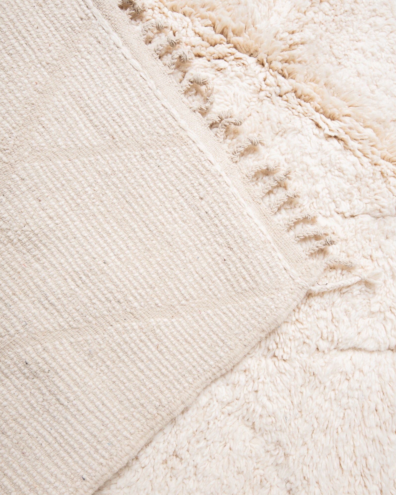Modern, designer, handcrafted Berber rug from Morocco. Beniourain carpet with beautiful colours and patterns and fluffy wool texture.